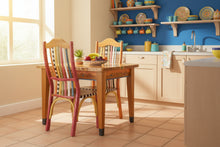 Load image into Gallery viewer, colorful kitchen table with a river and colorful wood chairs in a kitchen